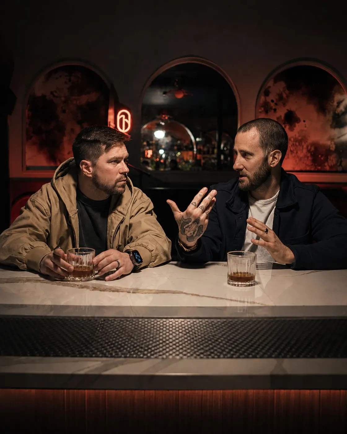 Ricky Seaman and director Mark Dearborn talking over drinks at a New York bar